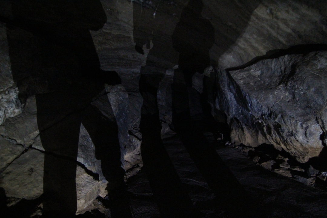 Shadows in a dark, limestone cave