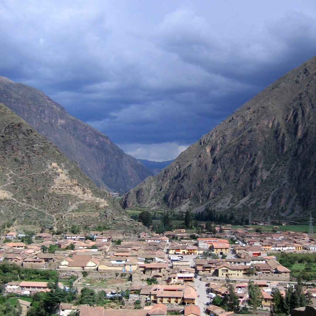 Ollantaytambo, Urubamba valley of Peru with storm clouds in the sky.