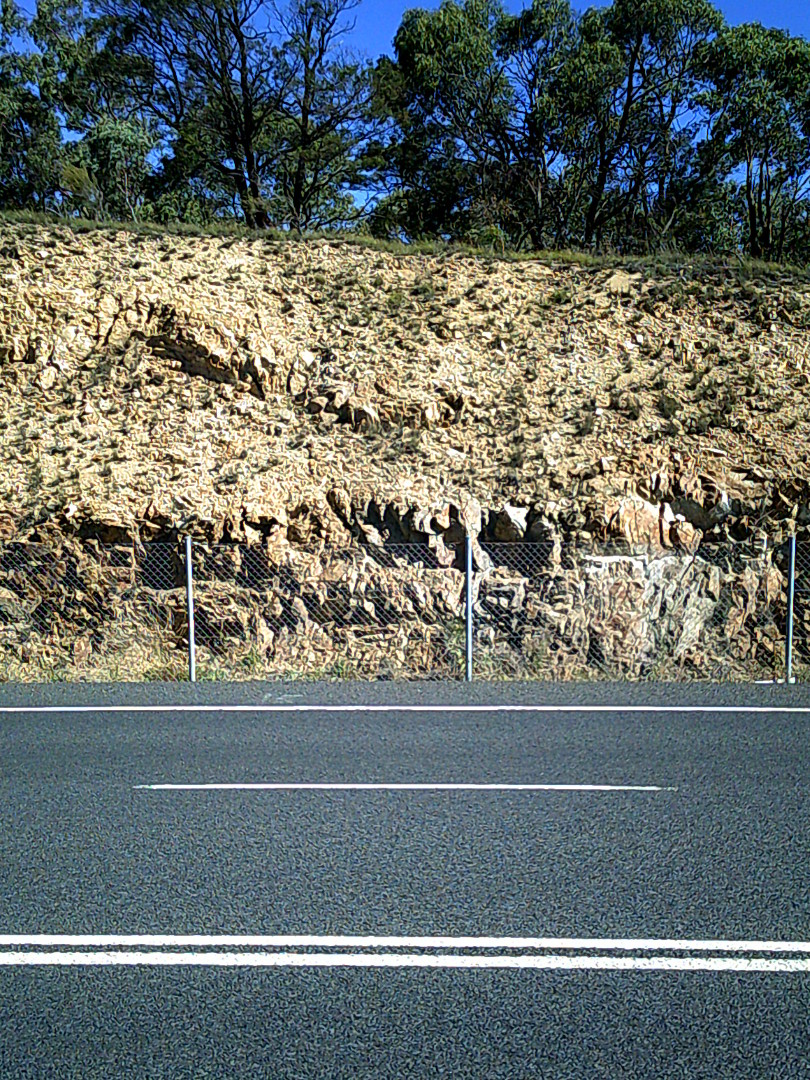 Road cut showing the geological history of the land